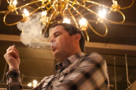 Kevin Murray smokes an E cigarette inside City Cigar Emporium Vancouver